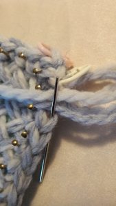 Needle back into last stitch